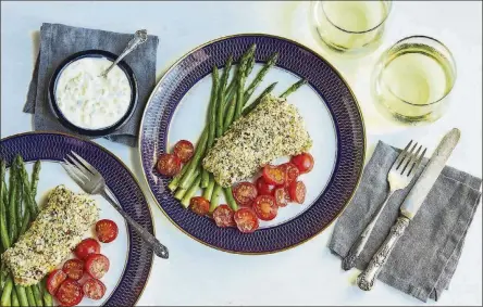  ?? CONTRIBUTE­D BY VIRGINIA WILLIS ?? Panko-crusted Fish Fillet with Spicy Remoulade with Oven-roasted Asparagus and Grape Tomatoes is an easy and flavorful meal in one that works with any fish fillet, fresh or frozen.