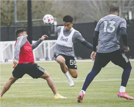  ?? BOB FRID/VANCOUVER WHITECAPS FC ?? Whitecaps midfielder Michael Baldisimo jumps past forward Lucas Cavallini during team training at UBC last month. The Caps take on the Portland Timbers on Sunday at their temporary home stadium in Sandy, Utah to open up the 2021 MLS season.