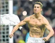  ??  ?? Real Madrid's Portuguese forward Cristiano Ronaldo celebrates after scoring a penalty during the UEFA Champions League quarter-final match against Juventus FC at the Santiago Bernabeu stadium in Madrid.