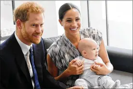  ?? TOBY MELVILLE / GETTY IMAGES ?? Prince Harry and Meghan, the Duke and Duchess of Sussex, with their baby son, Archie, announced plans to step back from most royal duties and move to Canada. Their plans have received tentative approval from Queen Elizabeth II.