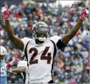  ?? MARK HUMPHREY — THE ASSOCIATED PRESS FILE ?? In this file photo, Denver Broncos defenders Champ Bailey (24) celebrates after the Broncos recovered a kickoff that the Tennessee Titans could not hang onto late in the fourth quarter of an NFL football game, in Nashville, Tenn.
