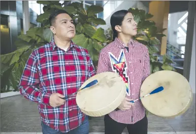  ?? Canadian Press photo ?? Young Spirit singers members (L to R) Jacob Faithful and Jarron Gadwa stand for a portrait inside the University of Saskatchew­an in Saskatoon, Jan. 20.