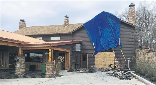  ?? JENNIFER SMOLA
DISPATCH ?? A tarp covers part of the Trout Club in Newark, which was damaged by a fire Saturday morning. The blaze at the popular restaurant, event space and golf facility started in a garage area beneath the facility’s TC Lounge. The fire has been ruled...