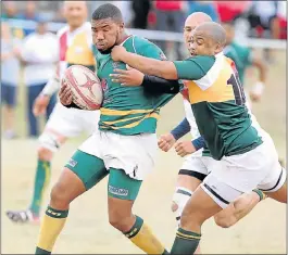  ?? Picture: BRIAN WITBOOI ?? HIGH GRAB: Wallabies’ Preston Statoe is tackled by Harlequins’ Luan Bosman during their Mayoral Cup match at Chapman High in Gelvandale