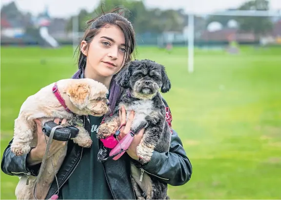  ?? Picture: Steve Brown. ?? Hayley Burt, 24, with her two dogs, Macy and Lola, who were attacked by a Jack Russell terrier in her local park.