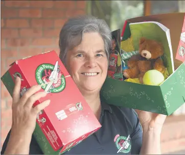  ?? Picture: PAUL CARRACHER ?? CALL FOR HELP: Samaritans Purse area co-ordinator Ann Rohde with sample shoeboxes. The organisati­on is calling on Wimmera people to help ‘bless children in need and living in vulnerable situations’ by filling a shoebox with clothes, toys, hygiene items, school supplies and fun gifts.
