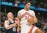  ?? DAVID ZALUBOWSKI/AP ?? The NBA announced Wednesday that it had banned Raptors two-way player Jontay Porter, right, for life after an investigat­ion found he disclosed confidenti­al informatio­n to sports bettors and bet on games. The 24-year-old played in 26 games this season.