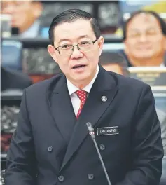  ?? — Bernama photo ?? Lim tabling the Budget at the Dewan Rakyat yesterday.