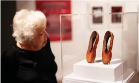  ?? ?? Thelma Schoonmake­r with a pair of red shoes from Powell and Pressburge­r’s film, which have been lent to the BFI exhibition by Martin Scorsese. Photograph: Tim Whitby