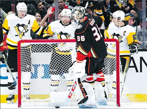  ?? GETTY IMAGES ?? The Pittsburgh Penguins — led by (from left) Evgeni Malkin, Phil Kessel and Sidney Crosby — have been on a huge roll since the New Year.