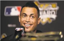  ?? Tim Bradbury / Getty Images ?? Giancarlo Stanton is due $285 million over the next 10 years, which is why the Marlins are willing to part with the All-Star.