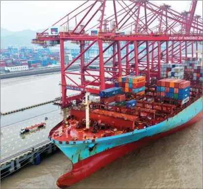  ?? YAO FENG / FOR CHINA DAILY ?? Maersk Sofia, a container ship currently sailing under the flag of Singapore, docks at the Dapukou container terminal of the Port of Ningbo Zhoushan in Zhejiang province on Feb 2.