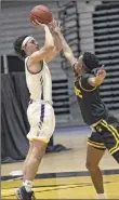  ?? Kathleen Helman / Special to TU ?? Ualbany’s Cameron Healy puts up a shot against a UMBC defender during their game on Saturday.