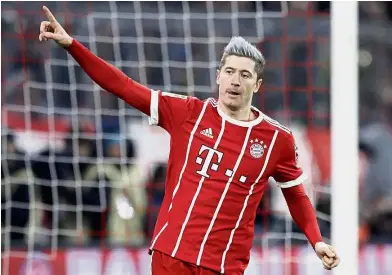  ??  ?? On fire: Robert Lewandowsk­i has 21 goals in all competitio­ns and scored in 12 of Bayern Munich’s 16 league games this season. — AP