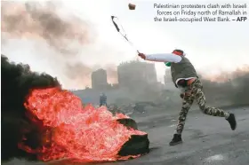  ?? — AFP ?? Palestinia­n protesters clash with Israeli forces on Friday north of Ramallah in the Israeli-occupied West Bank.