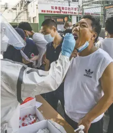  ?? KEVIN FRAYER/GETTY IMAGES ?? Authoritie­s are trying to contain the outbreak linked to the Xinfadi wholesale food market, Beijing’s biggest supplier of produce and meat.
