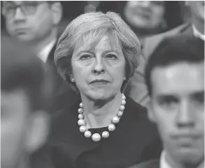  ?? CARL COURT / GETTY IMAGES ?? British Prime Minister Theresa May sits in the audience before delivering a speech about Brexit on the first day of the annual Conservati­ve Party conference on Sunday.