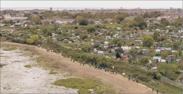  ?? Picture: Solent Sky Services ?? ON THE WATERFRONT An aerial drone shot of protesters, also picturd below, who are angry about the Aquind interconne­ctor plan