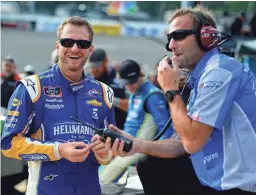  ?? GETTY IMAGES ?? Dale Earnhardt Jr. stands on the grid during qualifying for the NASCAR Xfinity Series GoBowling 250 at Richmond (Va.) Raceway on Sept. 21. Earnhardt retired from full-time racing after last season.