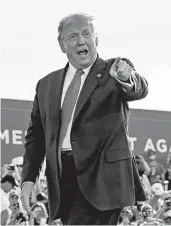  ?? EVAN VUCCI/AP ?? President Donald Trump arrives at a rally in Ocala, Florida, on Friday. Afterward, he traveled to neighborin­g Georgia.