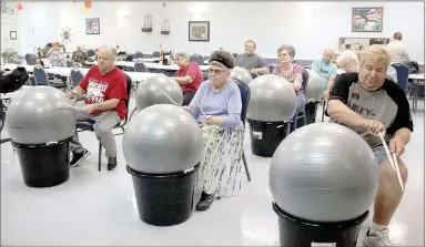  ?? LYNN KUTTER ENTERPRISE-LEADER ?? Lincoln Senior Center has a new exercise program that uses large exercise balls, drum sticks and colorful scarves.