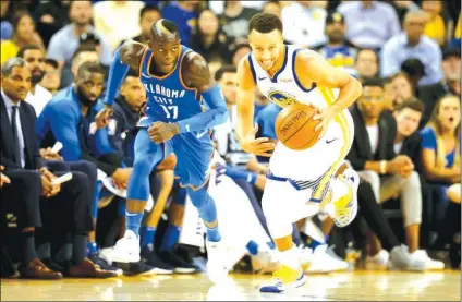  ?? (Ray Chavez/Bay Area News Group) ?? Golden State Warriors' Stephen Curry (30) dribbles past Oklahoma City Thunder's Dennis Schroder (17) after stealing the ball during the first half of their season opener at Oracle Arena in Oakland, Calif., on Tuesday, October 16, 2018.