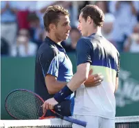  ?? AP ?? Britain’s Andy Murray shakes hands with Switzerlan­d’s Stan Wawrinka after winning his match. —