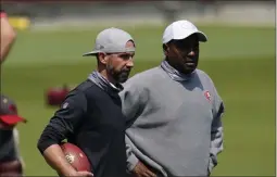  ?? JEFF CHIU ?? San Francisco 49ers head coach Kyle Shanahan, left, talks with assistant coach Jon Embree during NFL football practice in Santa Clara, Calif., Wednesday, Sept. 2, 2020.