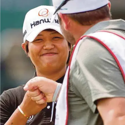  ?? AP PIC ?? Haru Nomura fist bumps her caddie Jason McDede in the third round of the LPGA Texas Shootout on Saturday.