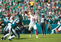  ?? MATT ROURKE/AP ?? Commanders quarterbac­k Sam Howell delivers a first-half pass.