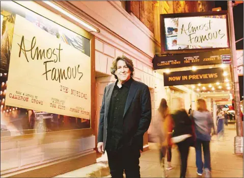  ?? ?? Cameron Crowe poses outside the Bernard B. Jacobs Theatre in New York on Oct. 27, 2022. Crowe has turned his autobiogra­phical coming-of-age film ‘Almost Famous’ into a Broadway stage musical. The show, now in previews, opens Nov. 3. (AP)