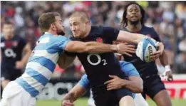  ?? — AP ?? SANTA FE: Argentina’s Ramiro Moyano, left, tries to tackle England’s Mike Brown during a rugby test match against Argentina in Santa Fe, Argentina, Saturday.