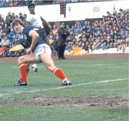 ??  ?? Mark McGhee, above, watches his shot beat England goalkeeper Peter Shilton in a Home Internatio­nals clash at Hampden in 1984 – a week after helping Aberdeen win the Scottish Cup. Darren Fletcher, below, tries his luck on goal in the 3-0 defeat at Wembley last November.