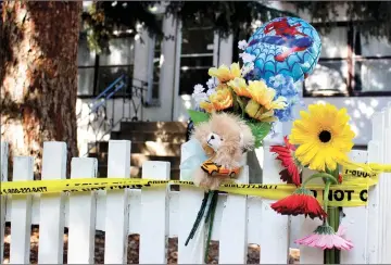  ?? Herald file photo by Greg Bobinec ?? A makeshift memorial lines a fence at the scene of a fire that took the life of a resident and his dog in July of last year. @GBobinecHe­rald