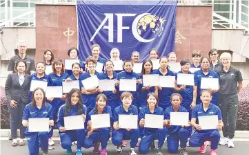  ??  ?? FOR THE ALBUM ... Petronella (4th left, middle row) poses with fellow participan­ts and tutors of the 1st AFC (Asian Football Confederat­ion) Women’s Tutors Course in Shanghai, China recently.