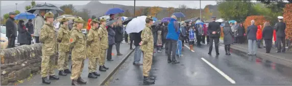  ??  ?? Large crowds usually gather at Remembranc­e services on Arran, such as this one at the Brodick cenotaph in 2018, however this year no services will be permitted outside of Places of Worship.