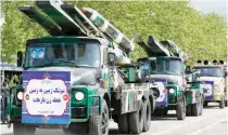  ?? ?? MISSILES ON PARADE – Missiles are carried on trucks during Army Day parade at a military base in northern Tehran, Iran, Wednesday, April 17, 2024.