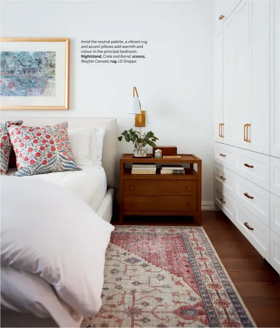  ??  ?? Amid the neutral palette, a vibrant rug and accent pillows add warmth and colour in the principal bedroom. Nightstand, Crate and Barrel; sconce, Wayfair Canada; rug, LD Shoppe.
H&H SEPTEMBER 2021 77