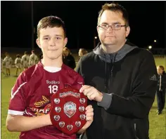  ??  ?? Dean Goodison of People Newspapers (sponsors) with Castletown captain Gavin McNulty.