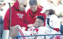  ?? AP,GETTYPHOTO­S ?? < Tua Tagovailoa’s last game with Alabama ended with a hip injury against Mississipp­i State on Nov. 16,2019.