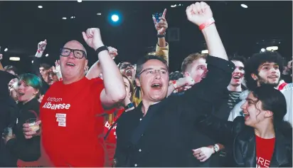  ?? (Jaimi Joy/Reuters) ?? SUPPORTERS IN Sydney react as they wait for Anthony Albanese to speak after Australia’s general election yesterday.