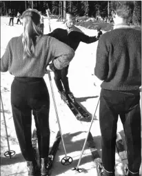  ?? Courtesy photo ?? A young Bill Burgess gives a skiing lesson to some newbies at Angel Fire Resort.