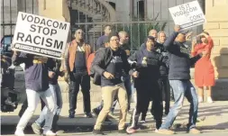  ?? Pictures: Ilse de Lange. ?? VOCAL. Protesters at the High Court in Pretoria yesterday demonstrat­e against Vodacom, which sought an interdict against Please Call Me inventor Nkosana Makate.