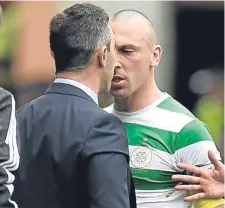  ??  ?? Scott Brown (right) exchanges words with manager Pedro Caixinha during Saturday’s Old Firm game.