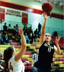  ?? TIM GODBEE / For the Calhoun Times ?? Calhoun’s Cassie Henderson (11) shoots over Rome’s Morgan Padgett during the first half of Monday’s game.