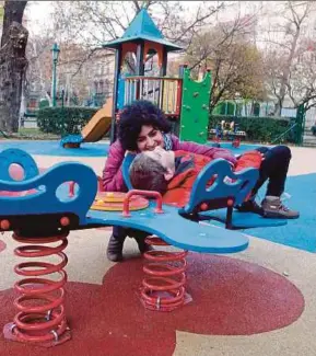  ?? AFP PIC ?? Eszter Harsanyi and her son, Aron, at a playground in Budapest.