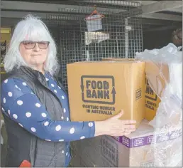  ??  ?? Emmanuel Care Centre Dubbo manager Geraldine Tosh with a recent delivery of 90 hampers given to them by Foodbank NSW. PHOTO: DUBBO PHOTO NEWS