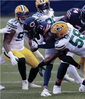  ?? DAN POWERS / USA TODAY NETWORK-WISCONSIN ?? Green Bay Packers inside linebacker Christian Kirksey (58) tackles Chicago Bears wide receiver Darnell Mooney on Sunday.