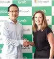  ??  ?? GRAB PRESIDENT Ming Maa and Microsoft Executive Vice-President of Business Developmen­t Peggy Johnson forge a partnershi­p to bring innovation and improved digital services on the leading Southeast Asia transporta­tion platform.