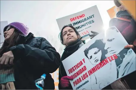  ?? Andrew Caballero-Reynolds AFP/Getty Images ?? PEOPLE PROTEST in 2018 against a bid to end temporary protected status for migrants from Haiti, Sudan, Nicaragua and El Salvador.